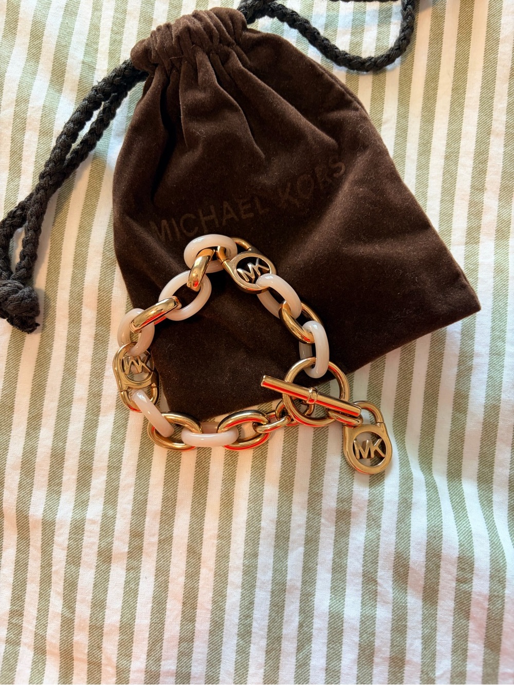 Michael Kors Gold and blush pink Link Toggle Bracelet with MK Charms